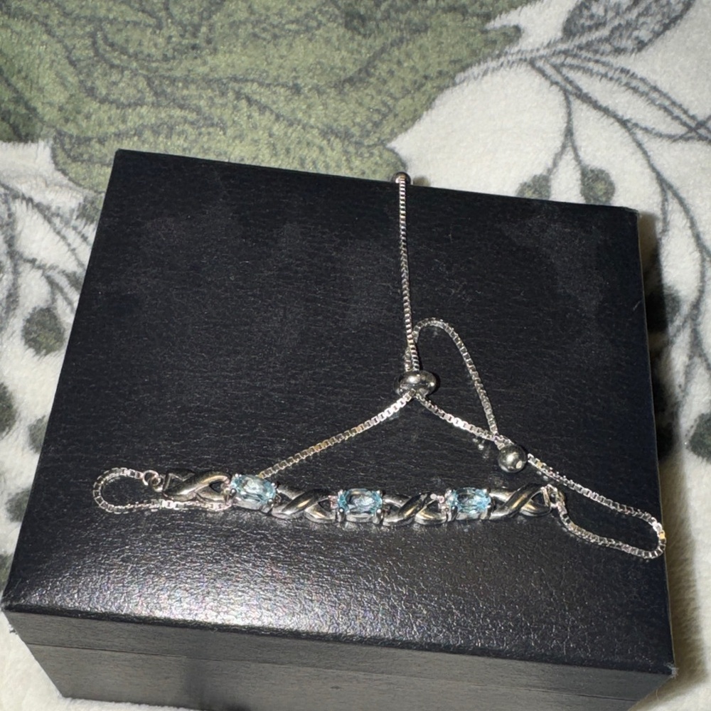 Elegant Sterling Silver Bracelet with Genuine Blue Topaz stones. EUC